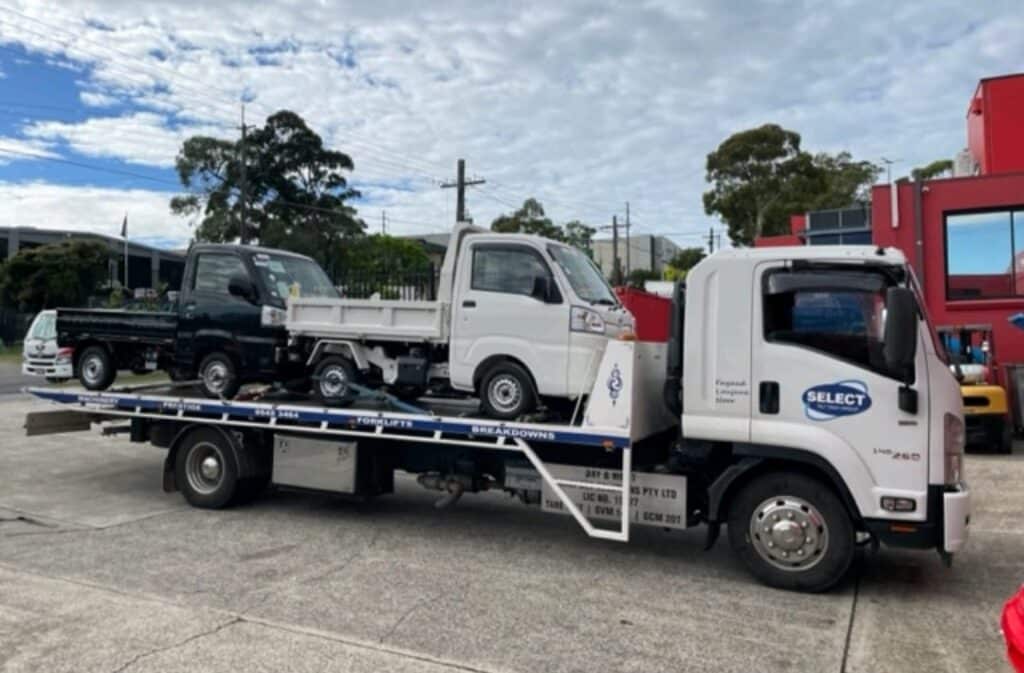 Two utes being transported